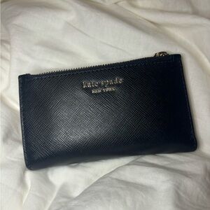 Kate Spade small bifold wallet. Black with pink interior. Great condition.